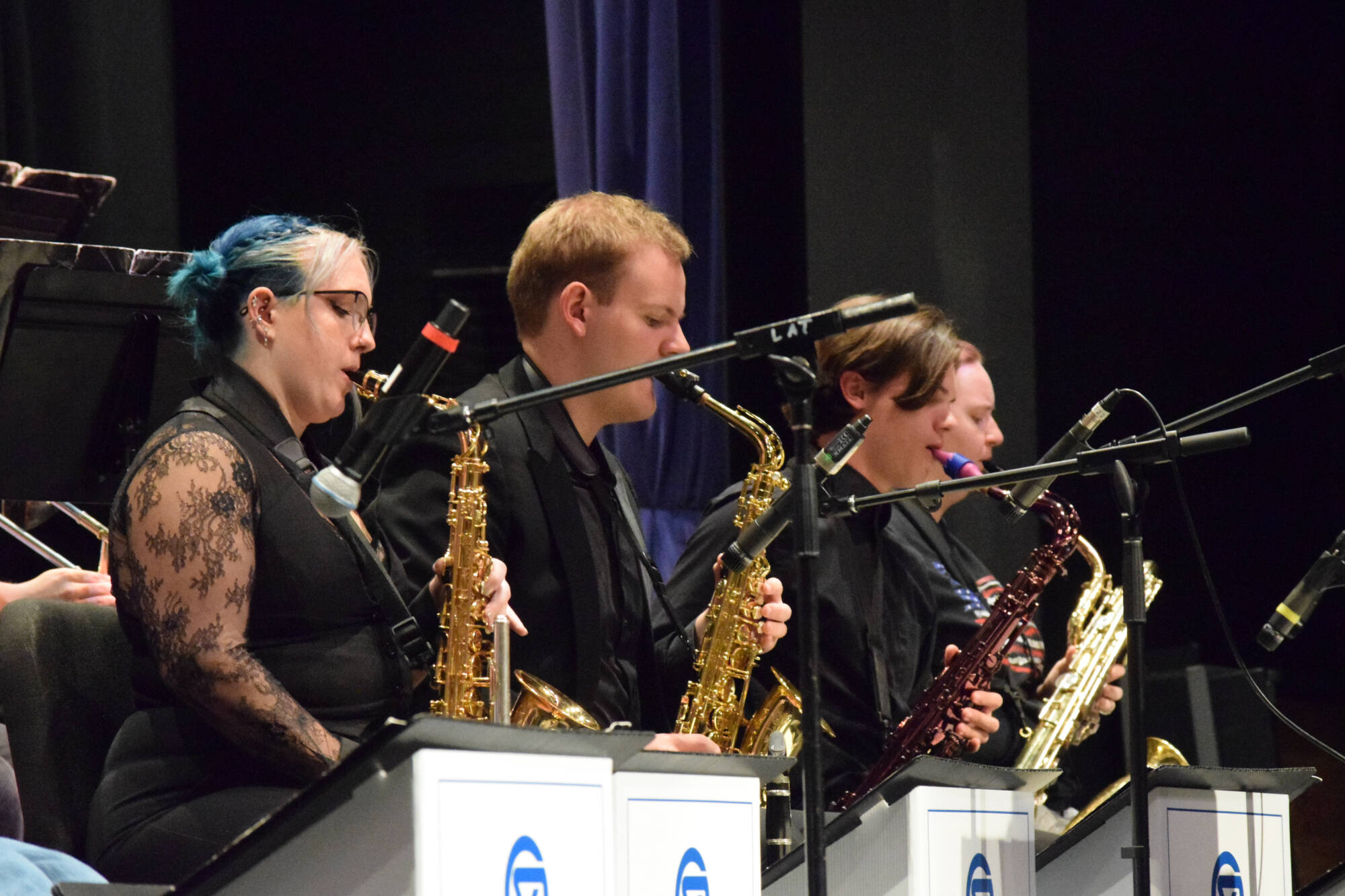 saxophones play in a jazz ensemble rehearsal